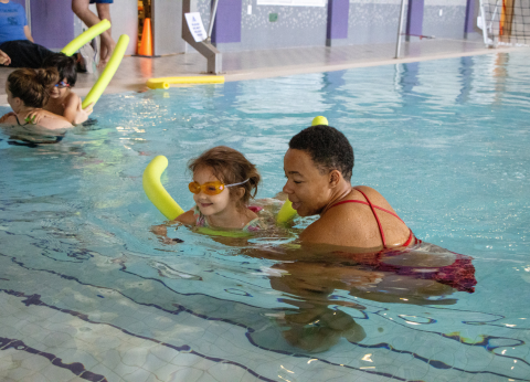 swim instructor with child