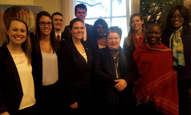 Faulty advisors Dr. Ante Sane (far right) and English Professor Dr. Besi Muhonja (second from right) and the team of student delegates meet with staff from the Namibian Embassy in D.C.