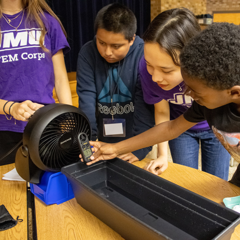 STEM Corps members and elementary aged students participating in a Technology for Energy lesson