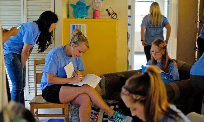 Photo of JMU students working at the autism clinic