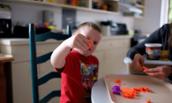 Photo of child holding craft piece