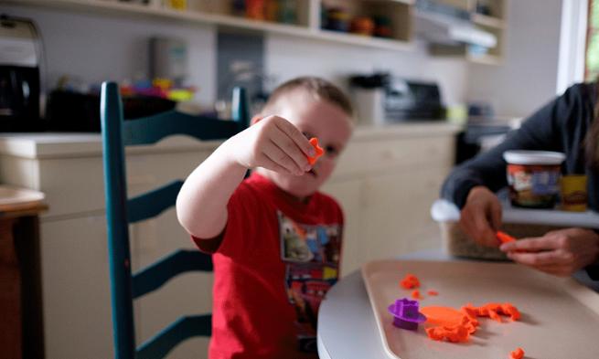 Photo of child holding craft piece