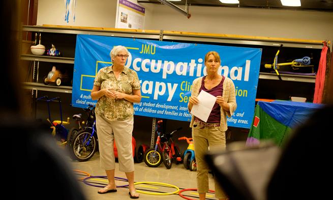 Photo of Marsha Longerbeam and Liz Richardson directing summer camp for children with autism