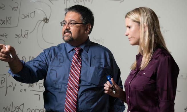 Devin Buennemeyer ('16), JMU  physics major, with professor Shanil Virani