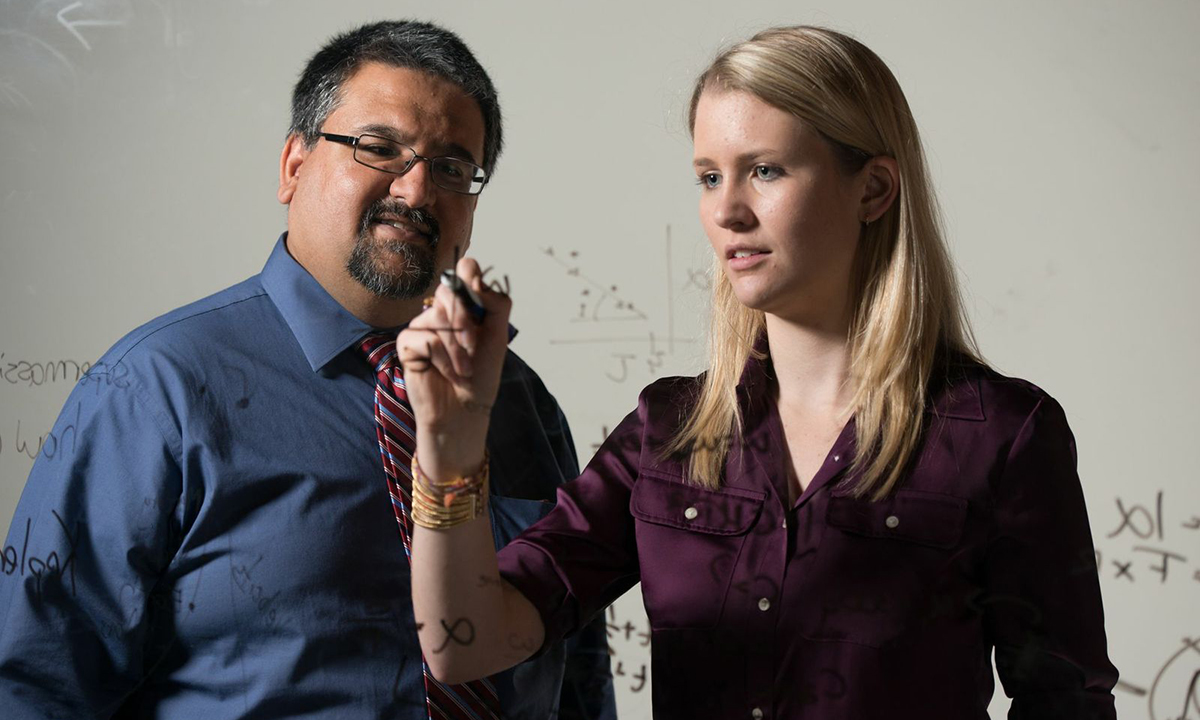 Devin Buennemeyer ('16), JMU  physics major, with professor Shanil Virani