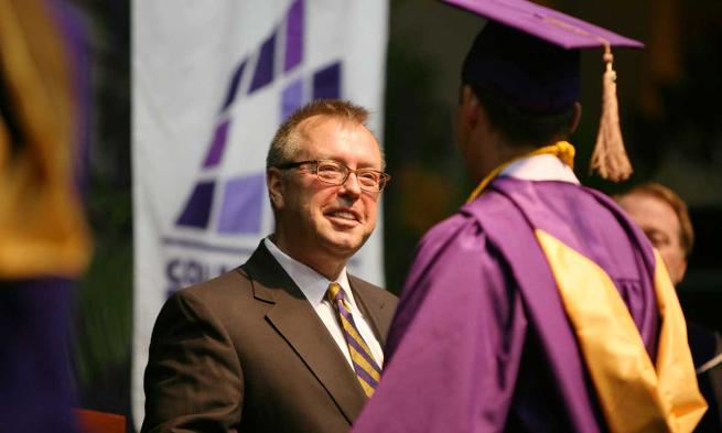 Don Rainey ('82) congratulates new members of Class of 2013