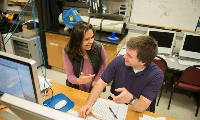 Astrophysicist Anca Constantin in lab with student