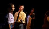 Photo of JMU senior Courtney Jamison and other performers rehearsing for Mainstage performance