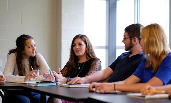 Photo of Debbie Sturm with Honors students