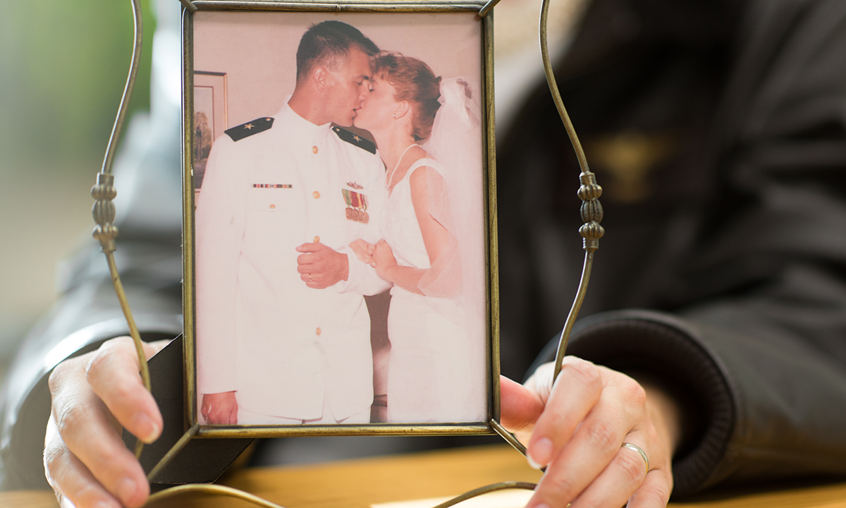 Dr. Jennifer Taylor, assistant professor of political science, holds wedding photo