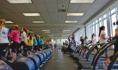 Photo of JMU students working out at UREC