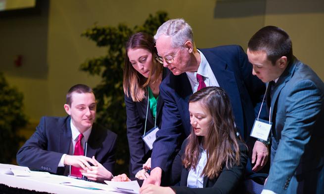 Dr. Timothy Walton and JMU students discussing research on CIA documents