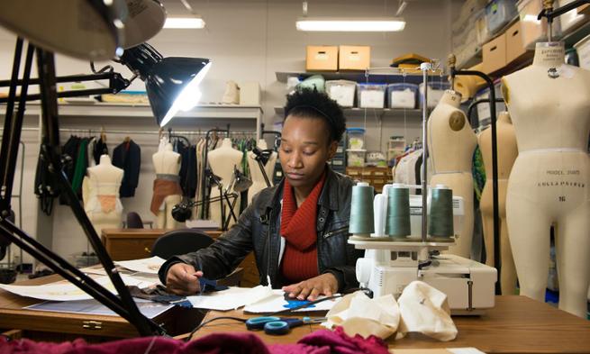 Dance major Kenisha Washington in the costume shop at JMU