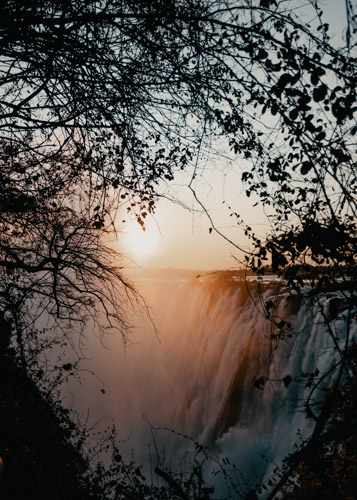 Photo of a waterfall at sunset