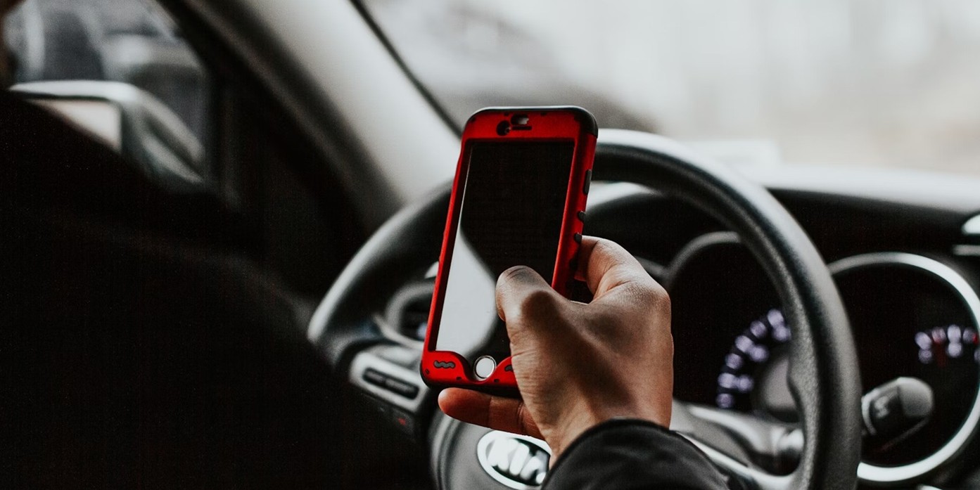 A driver looking at their phone.