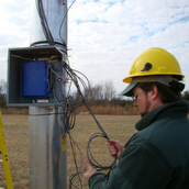 Image of Dr. Miles working on a data logger