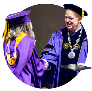 President Jim with graduate