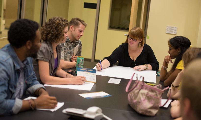 Group of students around table