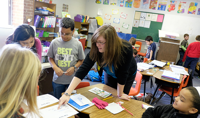 Student teacher with elementary school kids