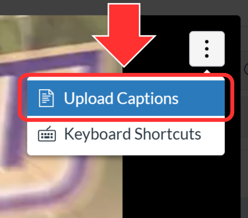 The expanded hamburger menu in the top right of the Canvas Files video player. An arrow points to the “Upload Captions” option.