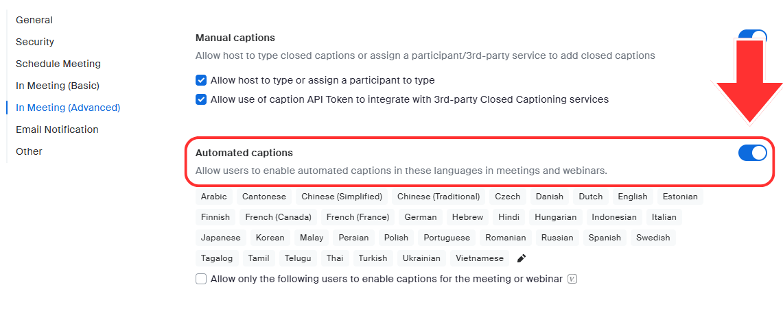 The JMU Zoom portal Meetings page. An arrow points to the slider button next to the Automated captions setting.
