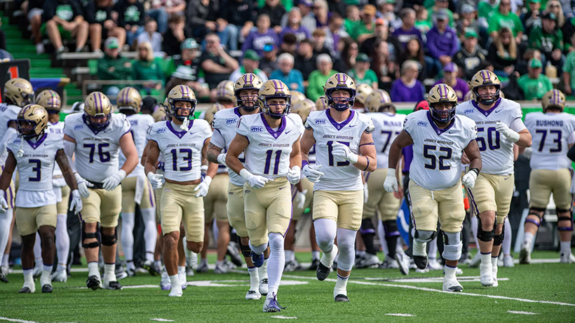 Football team running onto the field