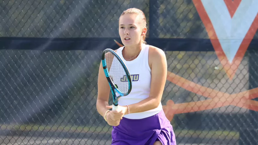 JMU Women's tennis player on the court