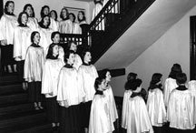 Glee Club walking down steps at Alumnae Hall