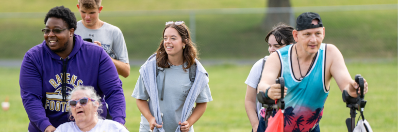 students walking with residents