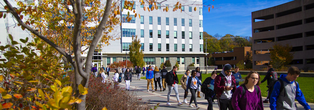 Photo of the HBS Building with Students Walking