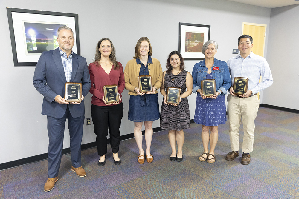 JMU Department of Health Professions Community Partner of the Year Award winners posing for photos.