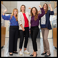 Global Sports Mentoring Program - Four women flexing bicep muscles