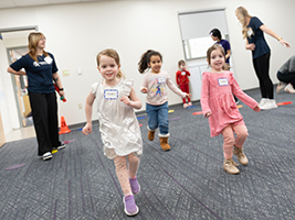 Students and children participate in exercise.