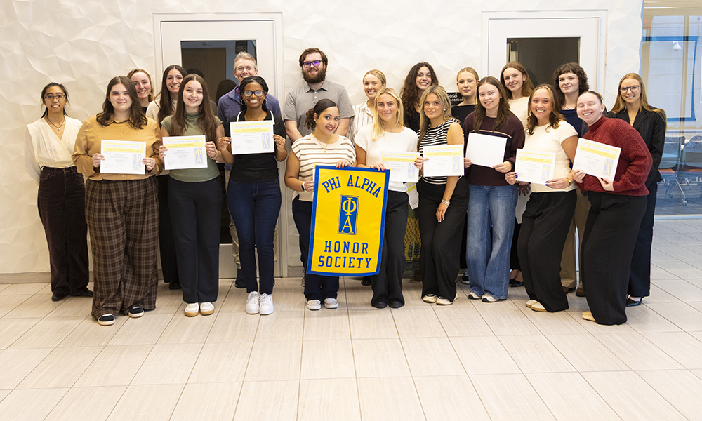 Phi Alpha Members and Advisors Celebrate New Member Induction in Spring 2026
