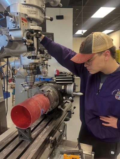 Jackson Lambert works on the Sirius I rocket in JMU Engineering’s machine shop