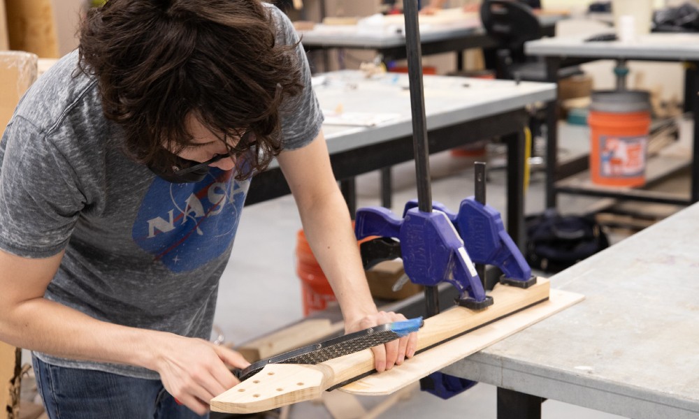 Robert Aguillen working on his guitar prototype