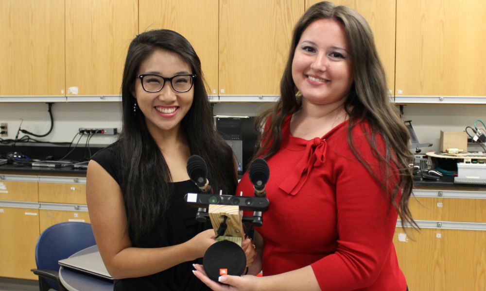 CS students hold echolocating machine