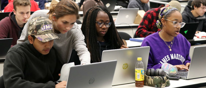Female student assisting in CS class