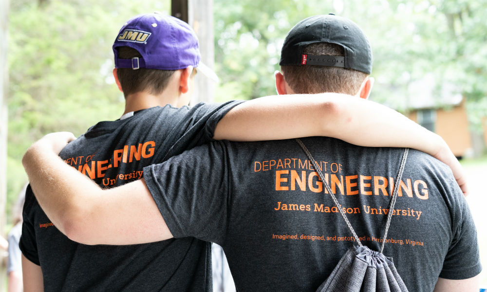 Two male engineering students standing side by side