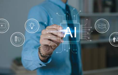 man pointing at ai letters on glass wondow
