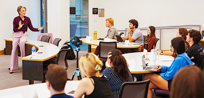 Carly Fiorina speaking to a College of Business class