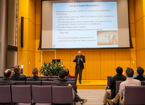 Peter Harms presents on stage in the Forum.