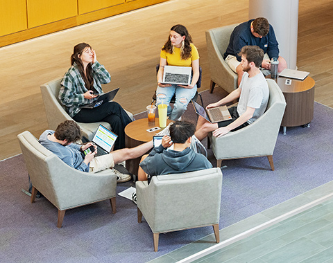 Aerial view of students sitting at tables together