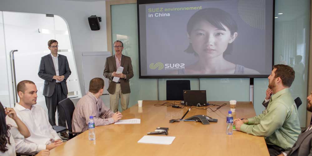 MBA Graduate Students watching a video presentation in Beijing China