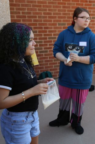 kid holding bag of homemade ice cream