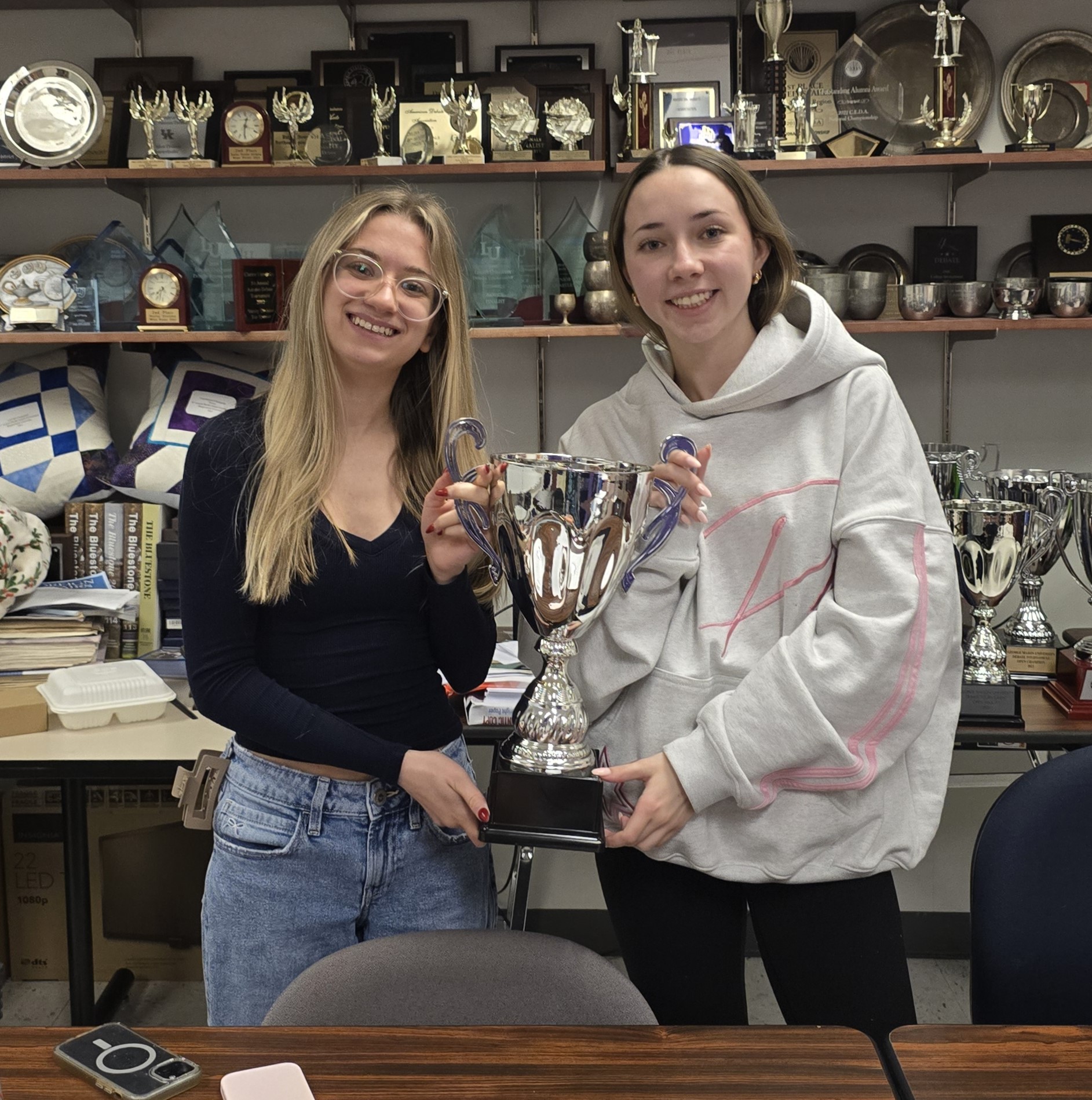 JMU Debate Team Holding Up Trophy