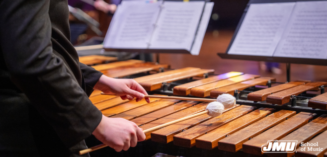 close up of mallet player playing marimba