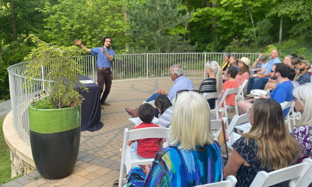 Speaker talking to a group at an education event at the EJC Arboretum.