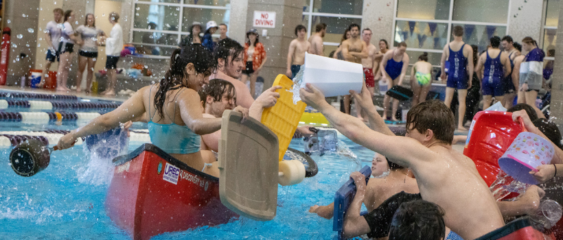 students playing Battleship in the pool