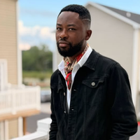 Black In Multiple Languages Headshot for Gbenga Adesina